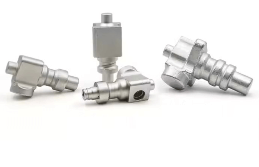 Set of stainless steel quick-connect hose fittings with barbed ends on a white background