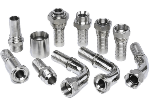 Variety of stainless steel hydraulic hose fittings and connectors on a white background
