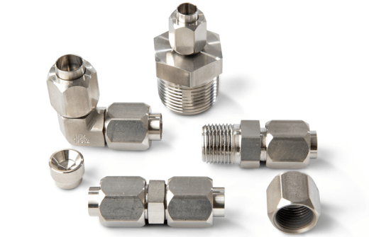 Collection of stainless steel pipe fittings and connectors on a white background