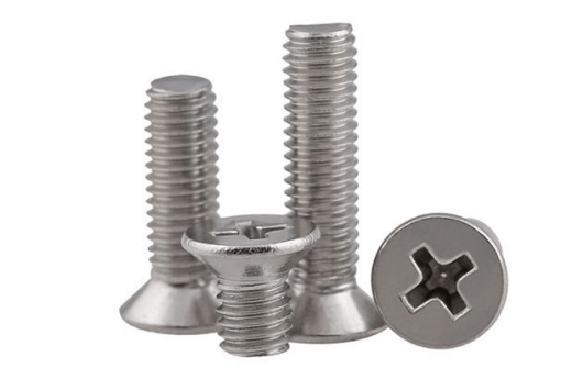 Set of stainless steel flat head Phillips screws with threaded shafts on a white background