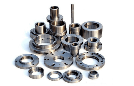 Collection of precision machined metal rings and flanges.